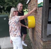 Lower Bygrave Defibrillator being installed